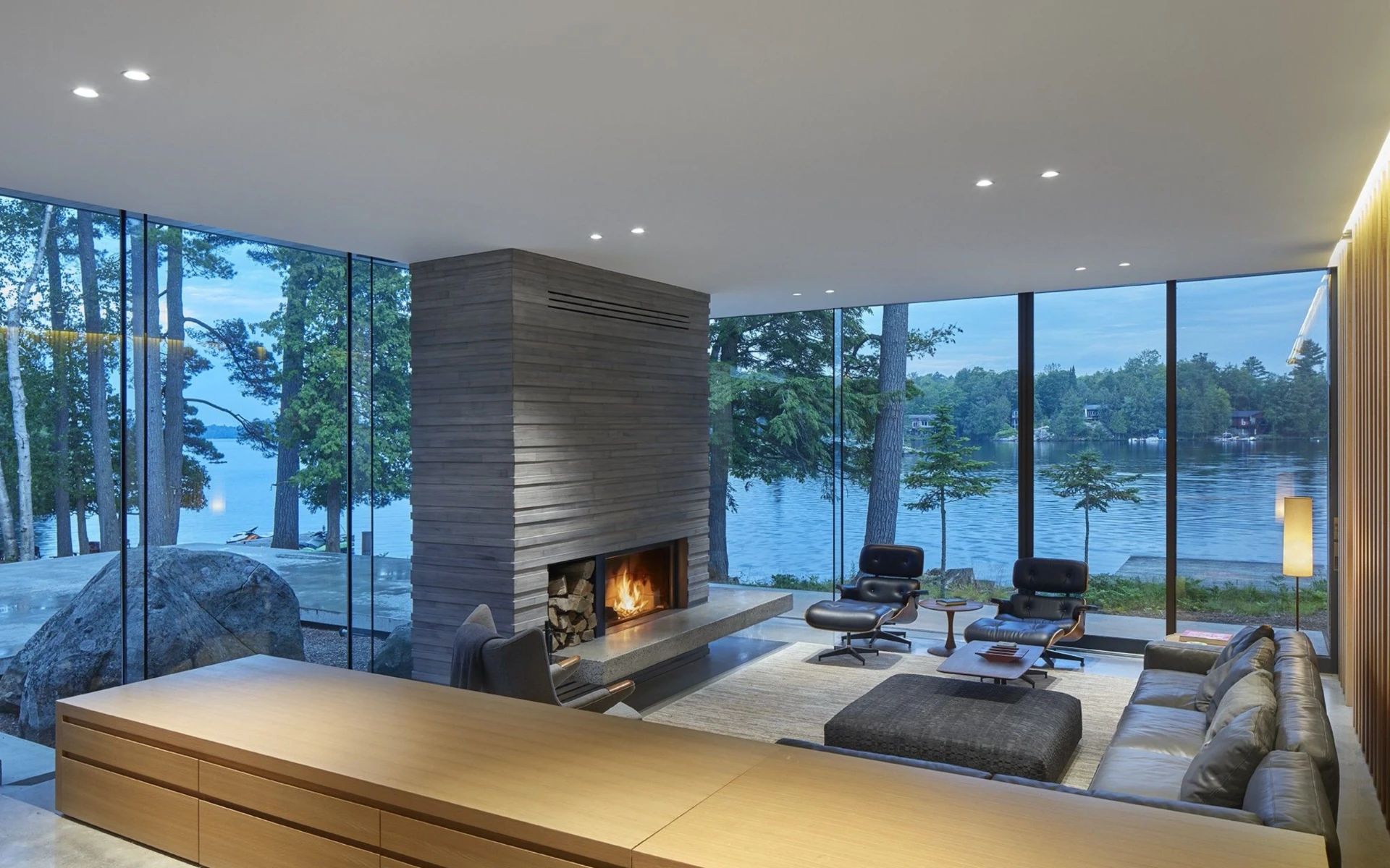 Lakeside living room with floor-to-ceiling windows