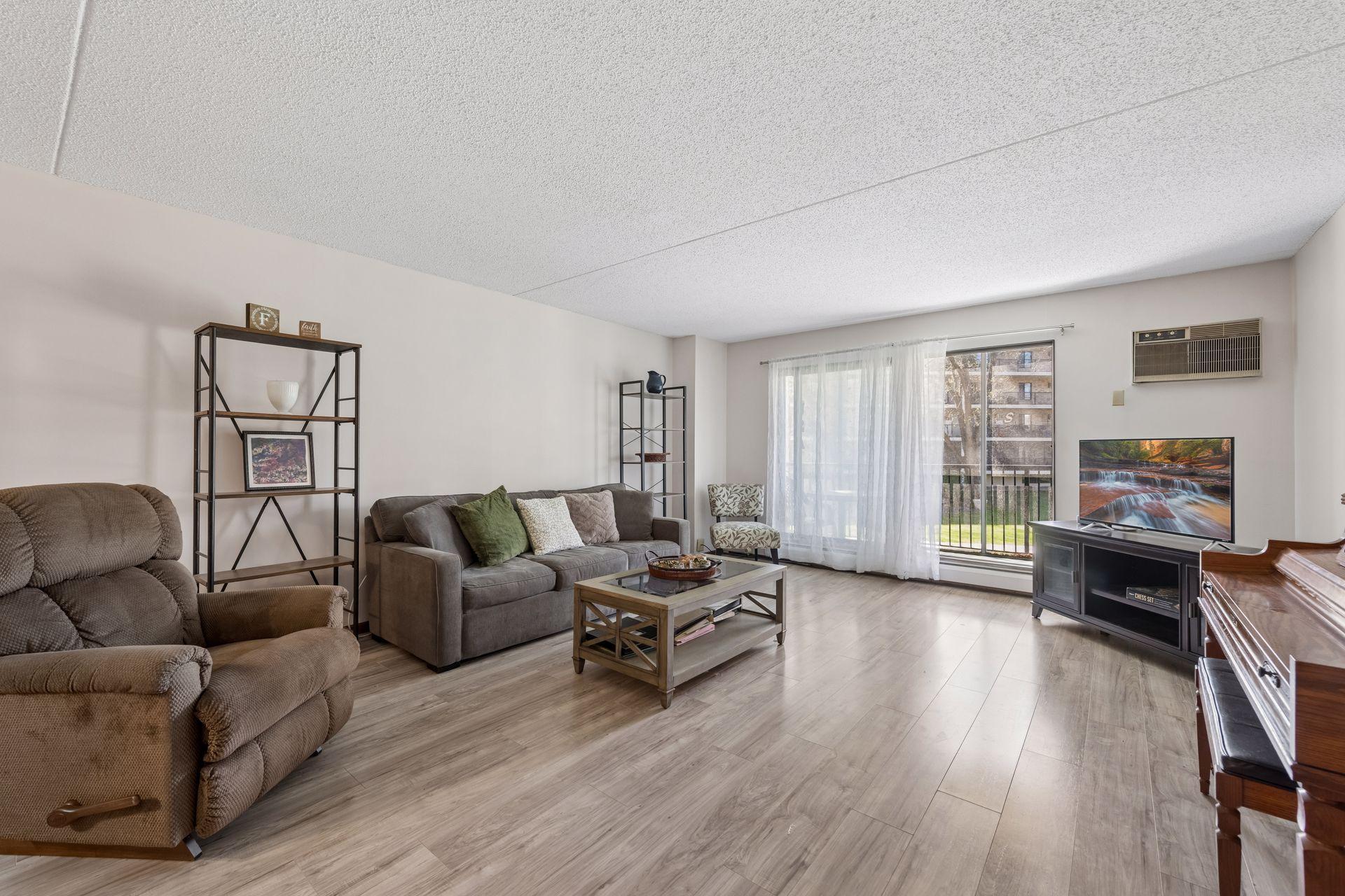 View of (CC) High Rise (4+ Levels) at 10531 Cedar Lake Road, Minnetonka - Mike Wilen | Minnesota Team Real Estate
