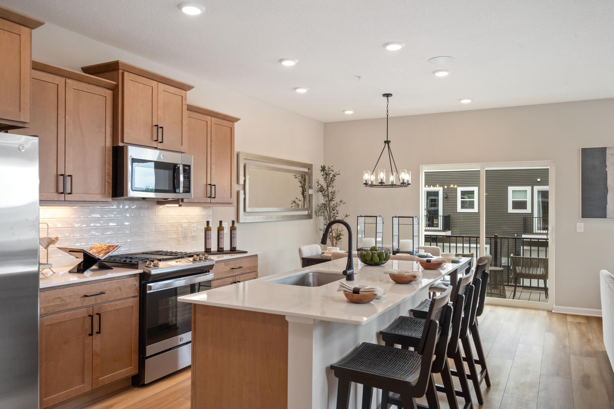 View of (TH) Side x Side at 13627 Pine Drive, Rogers - Mike Wilen | Minnesota Team Real Estate