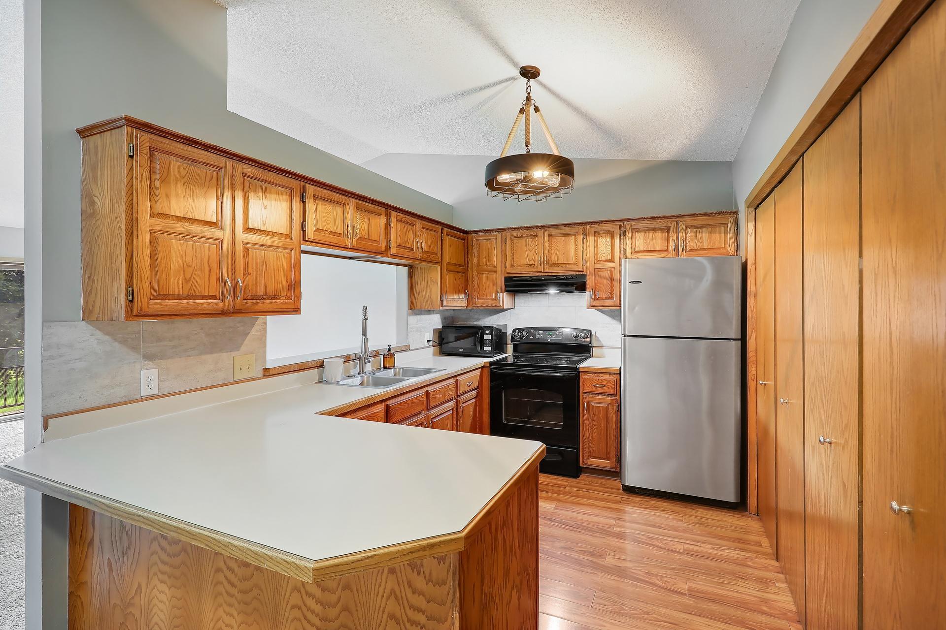 View of (TH) Side x Side at 11139 Edgewood Circle, Champlin - Mike Wilen | Minnesota Team Real Estate