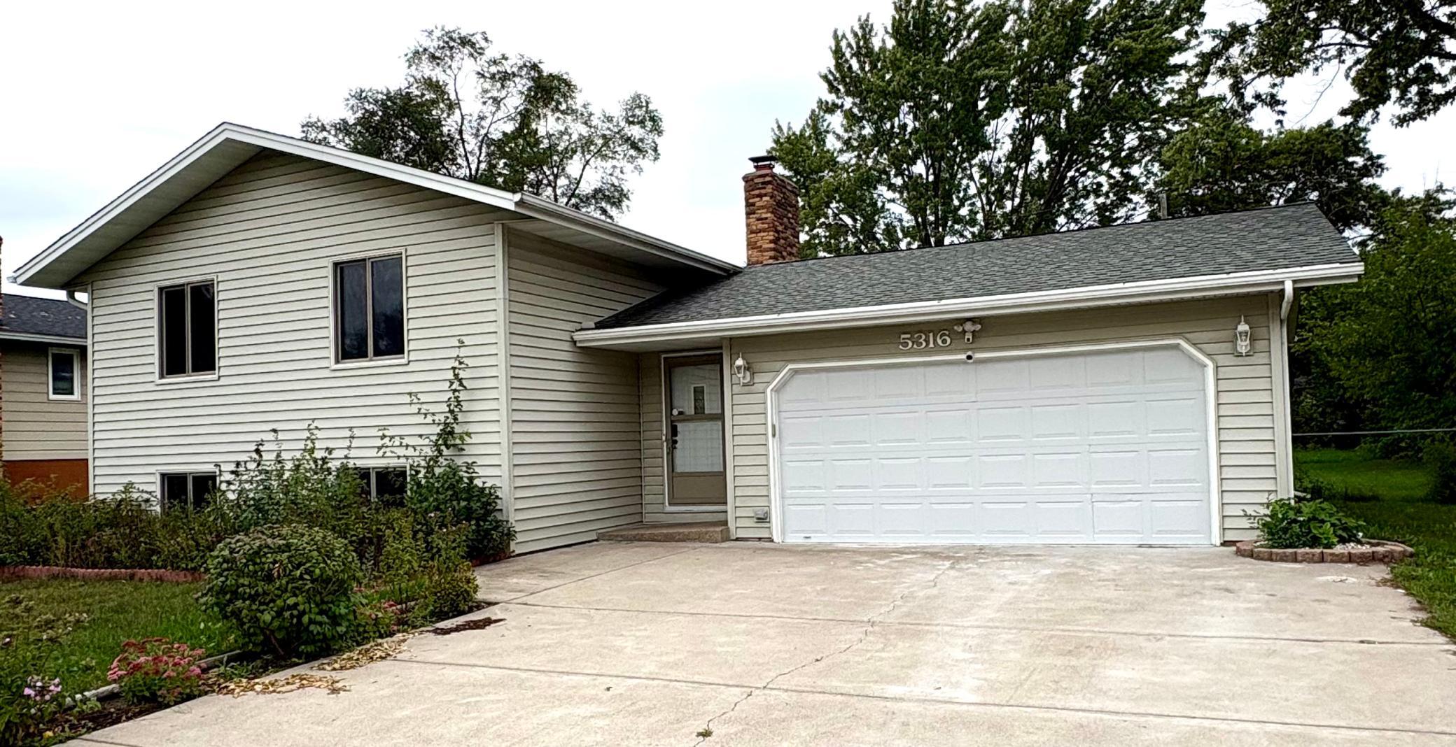 View of Single Family at 5316 Brookdale Drive, Brooklyn Park - Mike Wilen | Minnesota Team Real Estate