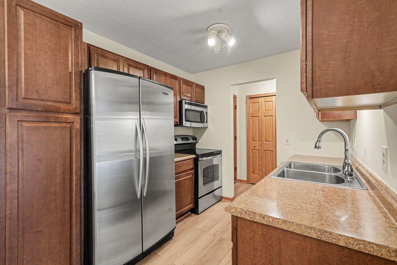 View of (CC) Low Rise (3- Levels) at 205 Barry Avenue, Wayzata - Mike Wilen | Minnesota Team Real Estate